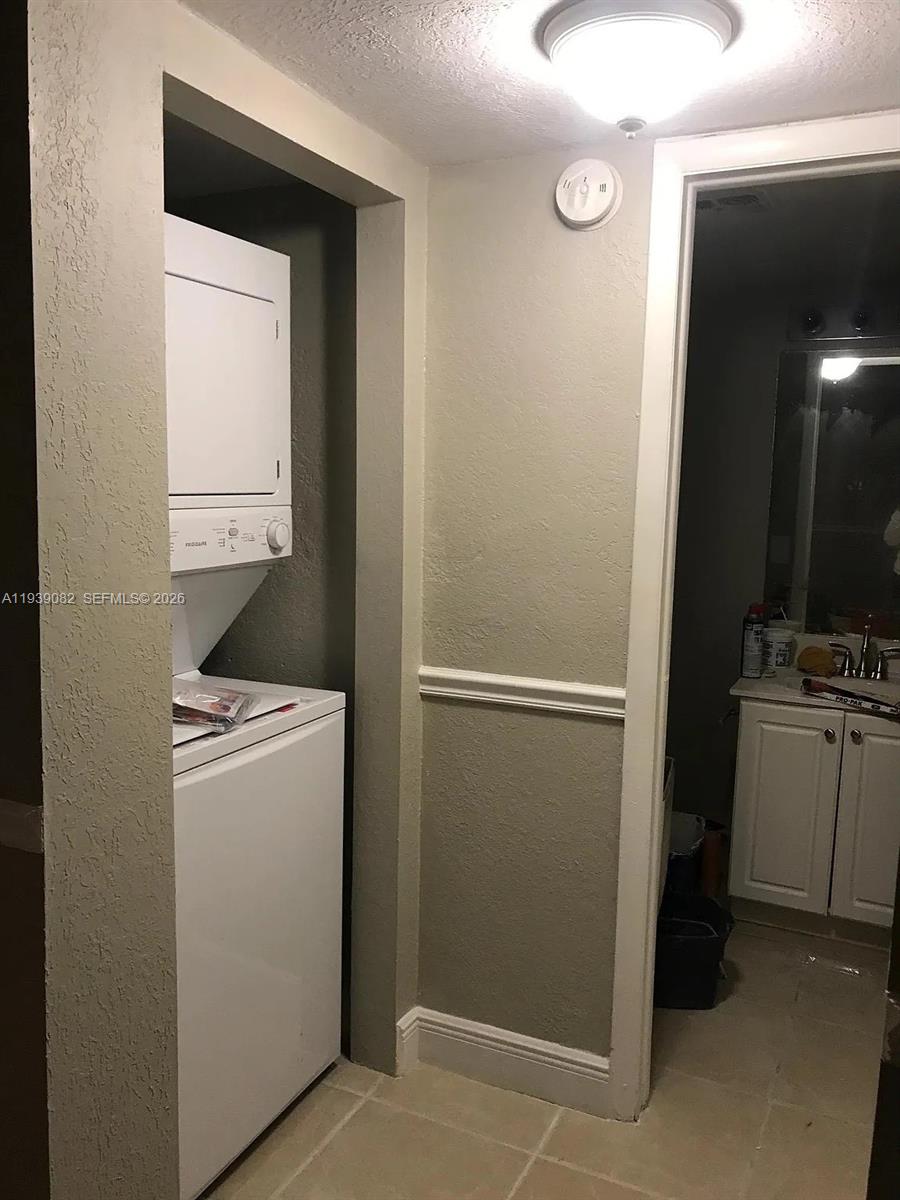9441 Southwest 76th Street, Unit V33 Miami, FL 33173 - Photo 18 of 21 a room with storage and utility