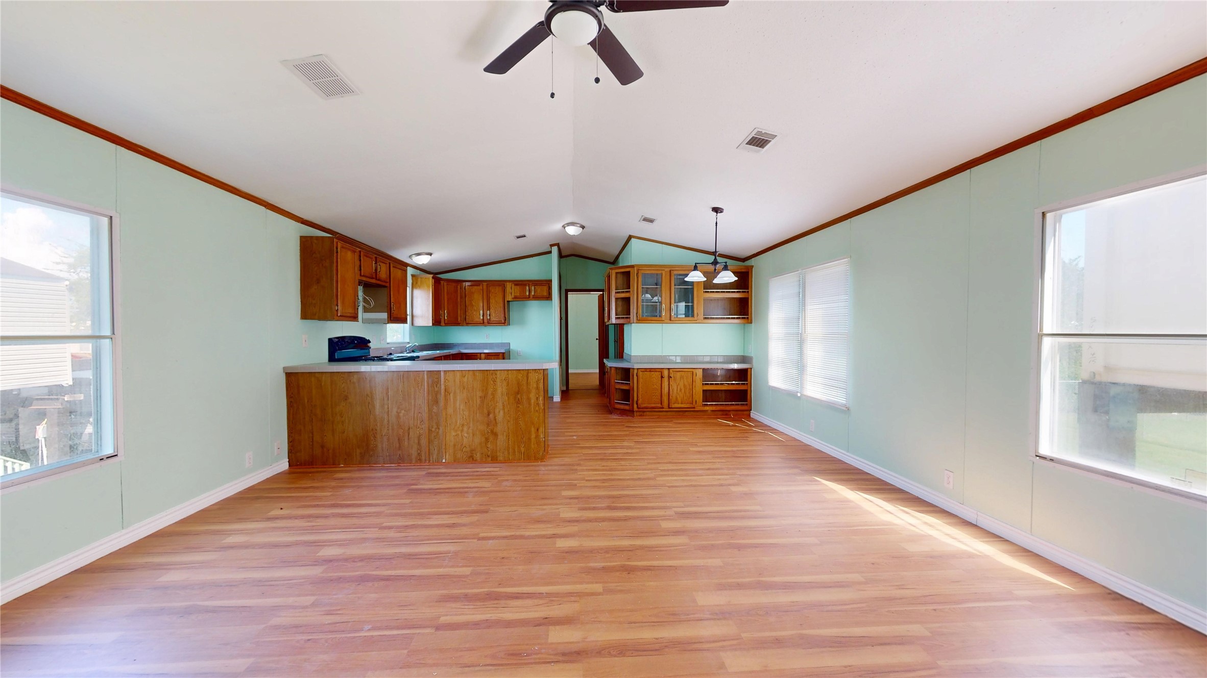435 16th Street San Leon, TX 77539 - Photo 11 of 44 a view of kitchen and hall with wooden floor