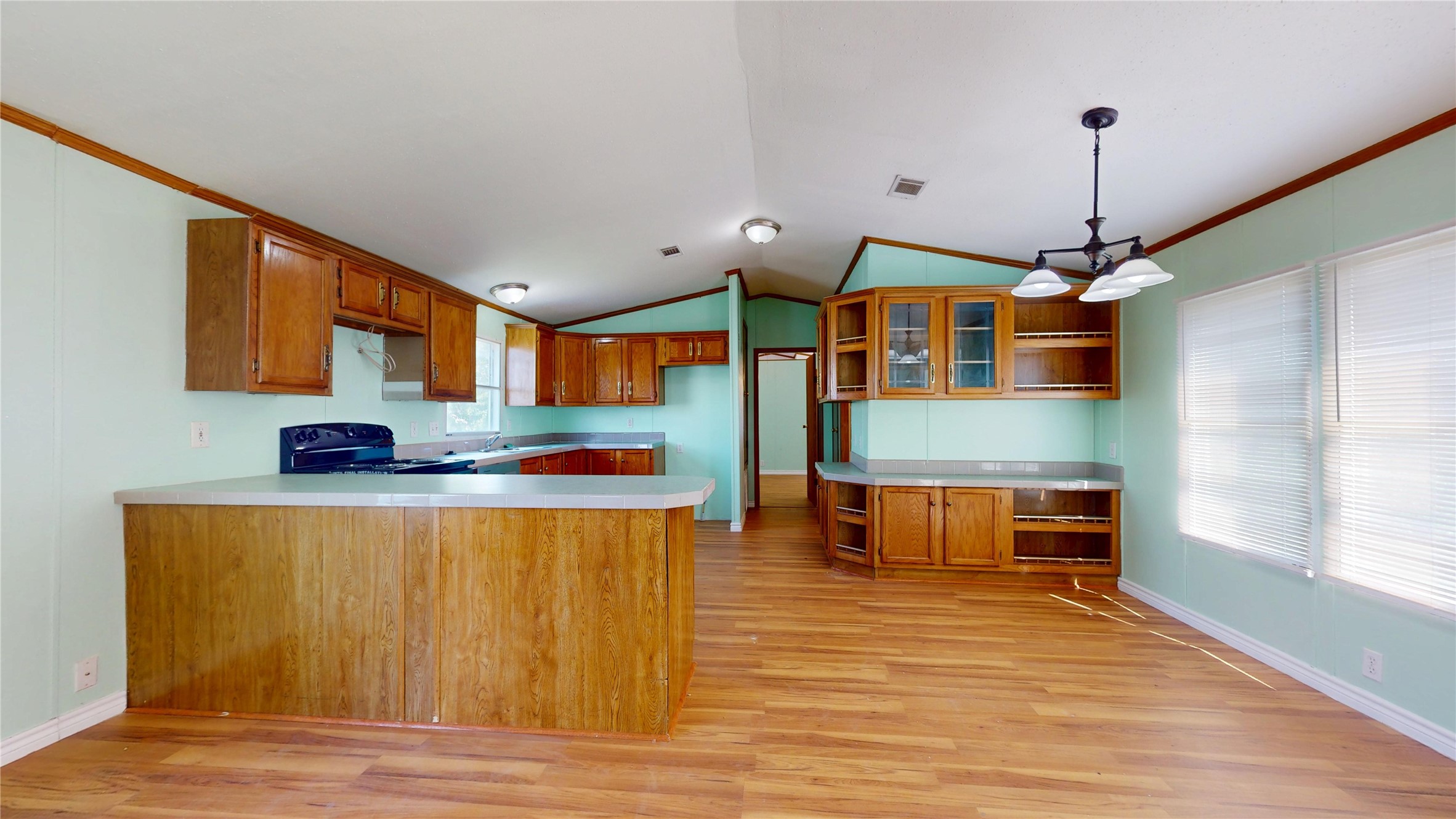 435 16th Street San Leon, TX 77539 - Photo 15 of 44 a kitchen with stainless steel appliances granite countertop a stove a sink and a refrigerator
