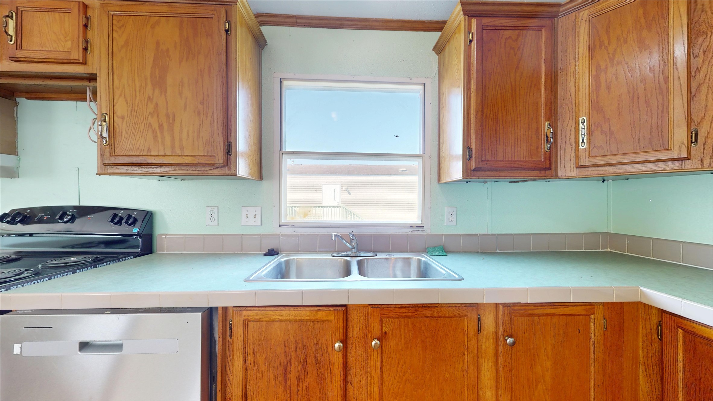 435 16th Street San Leon, TX 77539 - Photo 17 of 44 a kitchen with a sink and cabinets