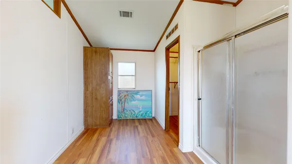 a view of hallway with natural light