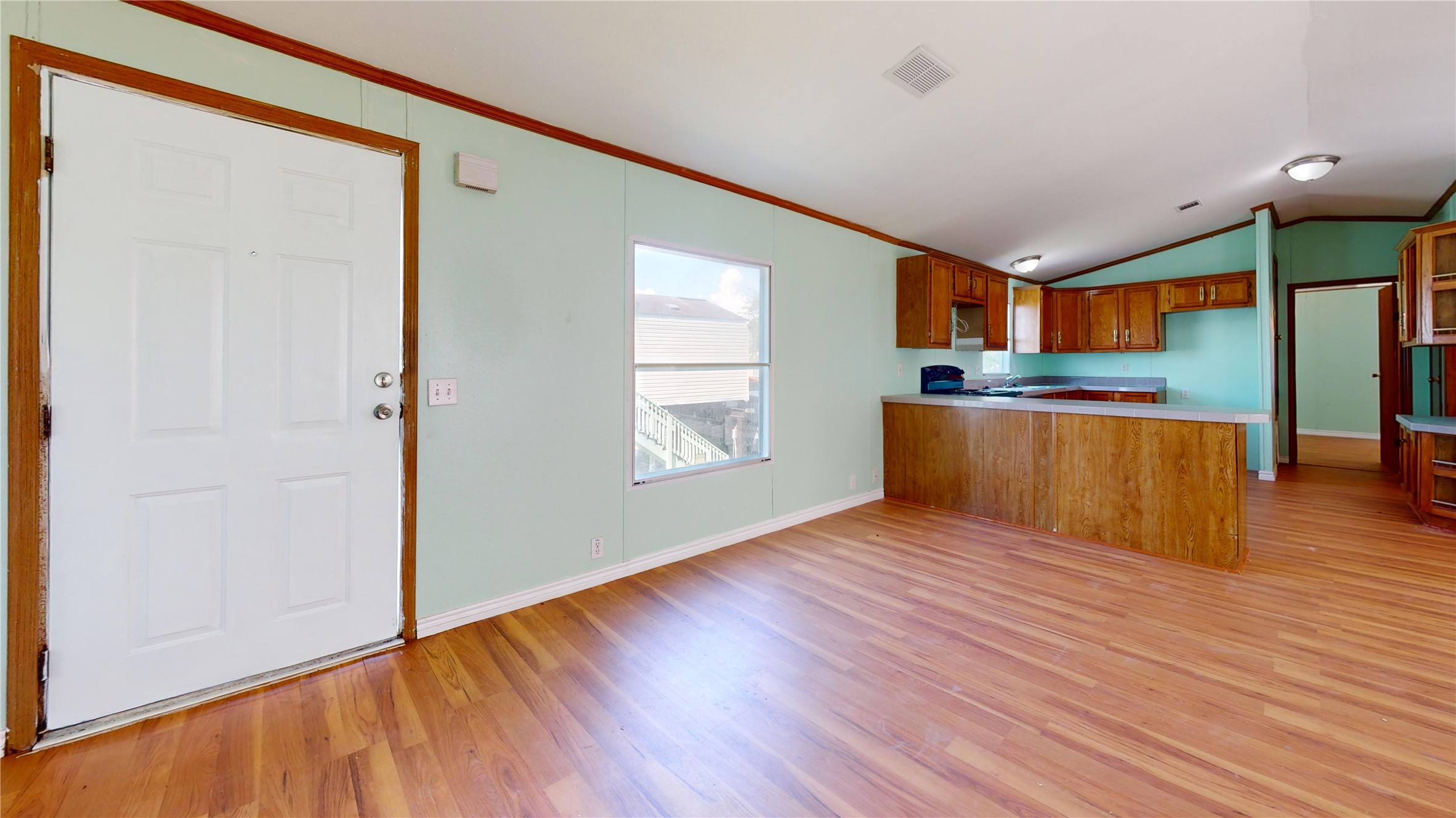 435 16th Street San Leon, TX 77539 - Photo 40 of 44 an empty room with wooden floor and windows
