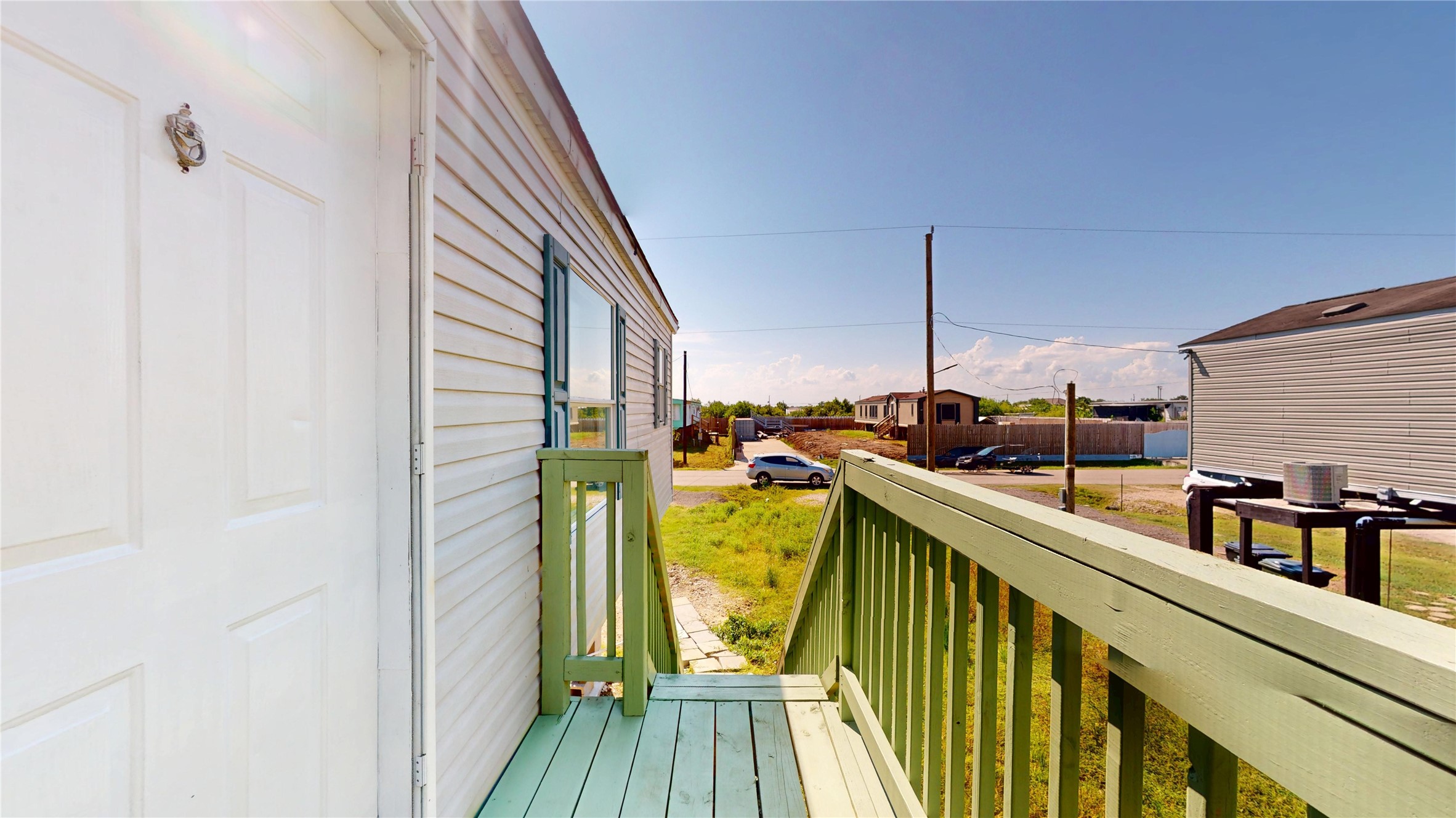 435 16th Street San Leon, TX 77539 - Photo 6 of 44 a view of a balcony with wooden floor