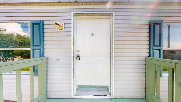 a front view of a house with a porch