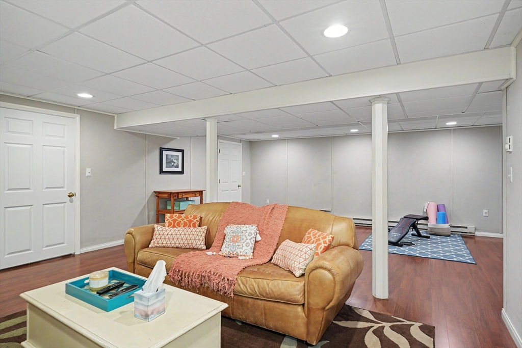15 Lanthorn Road Northborough, MA 01532 - Photo 36 of 37 a living room with furniture and a wooden floor