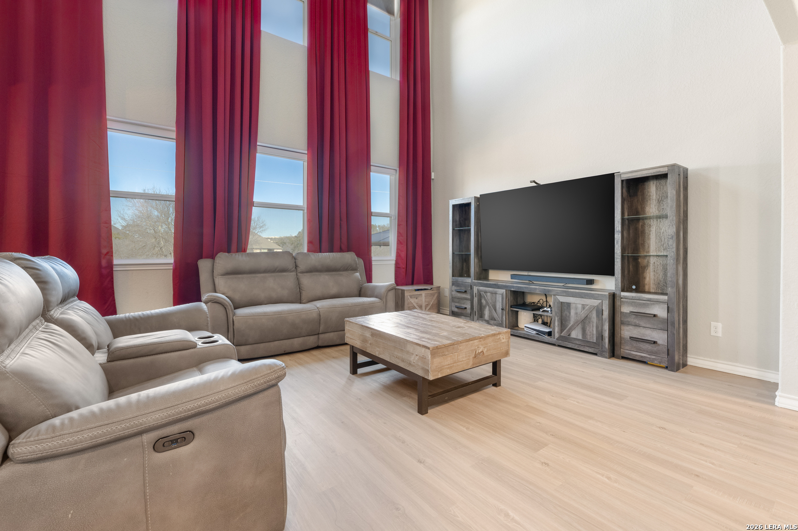229 Jereth Crossing Castroville, TX 78009 - Photo 12 of 41 a living room with furniture and a flat screen tv