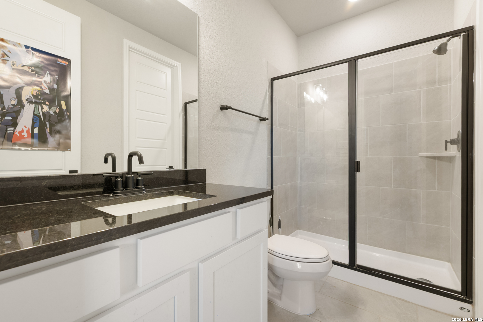 229 Jereth Crossing Castroville, TX 78009 - Photo 36 of 41 a bathroom with a double vanity sink toilet mirror and shower