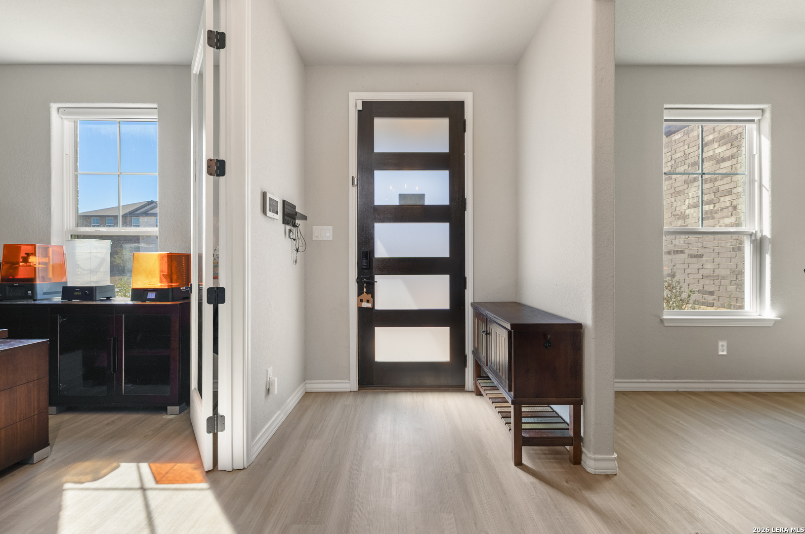 229 Jereth Crossing Castroville, TX 78009 - Photo 4 of 41 a view of a livingroom with wooden floor and a window