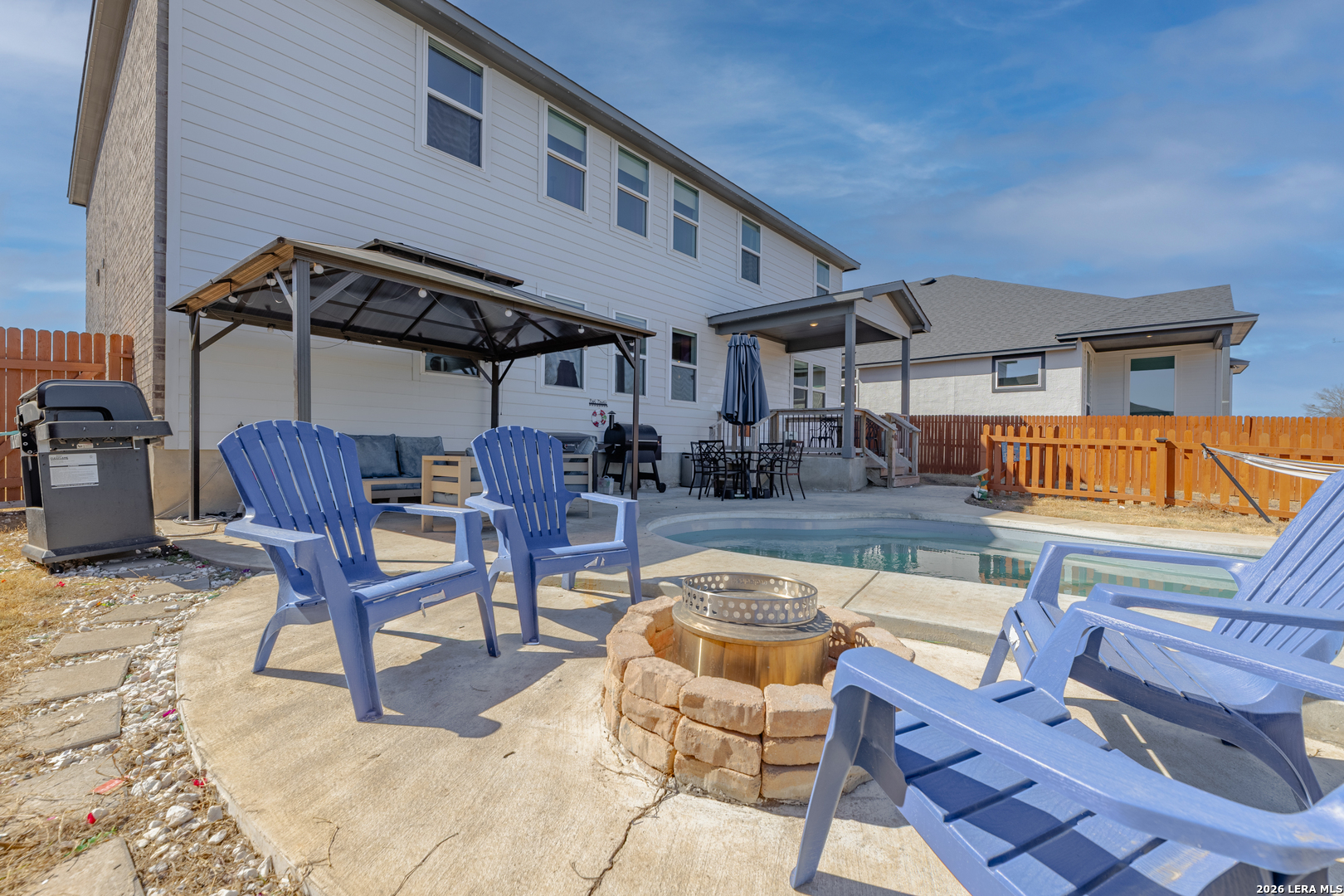 229 Jereth Crossing Castroville, TX 78009 - Photo 41 of 41 a view of a patio with swimming pool table and chairs