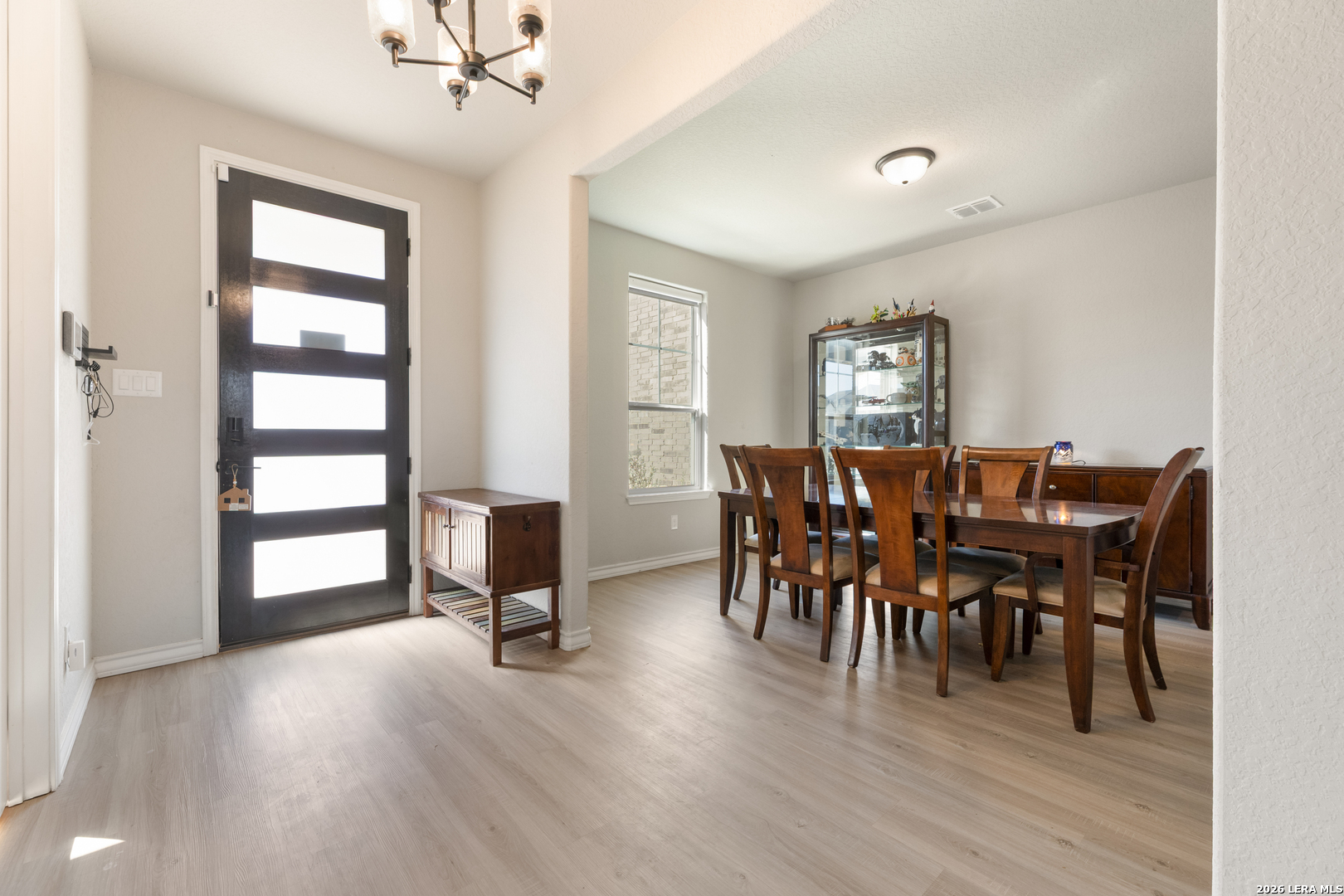 229 Jereth Crossing Castroville, TX 78009 - Photo 6 of 41 a view of a dining room with furniture and a window