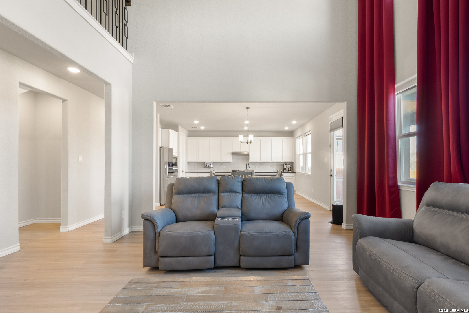 229 Jereth Crossing Castroville, TX 78009 - Photo 10 of 41 a living room with furniture and a view of kitchen