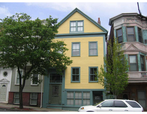 267 Bunker Hill Street Boston, MA 02129 - Photo 1 of 14 a front view of a house with a yard