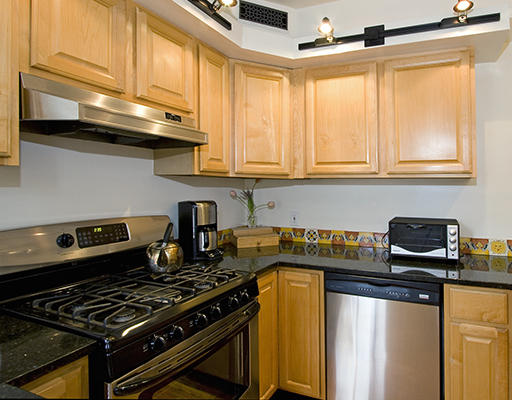 267 Bunker Hill Street Boston, MA 02129 - Photo 11 of 14 a kitchen with stainless steel appliances granite countertop a stove and a sink