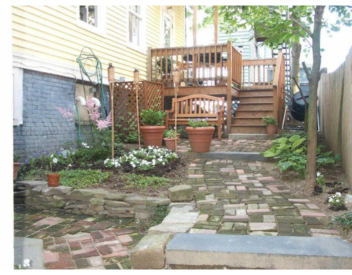 267 Bunker Hill Street Boston, MA 02129 - Photo 14 of 14 a front view of a building with garden