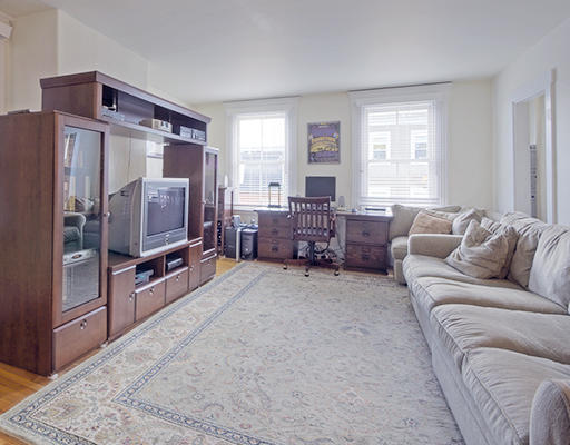 267 Bunker Hill Street Boston, MA 02129 - Photo 4 of 14 a living room with furniture and a flat screen tv