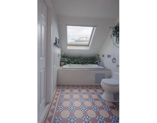 267 Bunker Hill Street Boston, MA 02129 - Photo 7 of 14 a bathroom with a toilet a sink and a bathtub