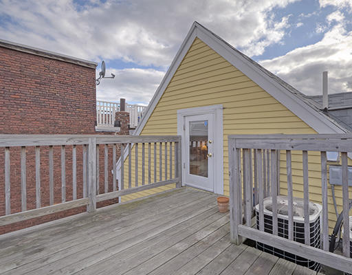 267 Bunker Hill Street Boston, MA 02129 - Photo 9 of 14 a view of a house with wooden deck