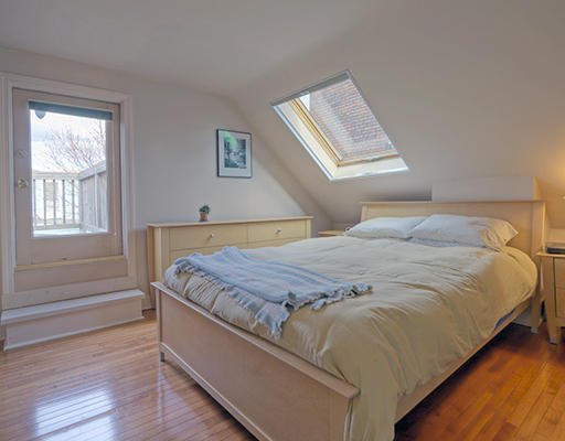 267 Bunker Hill Street Boston, MA 02129 - Photo 10 of 14 a bed sitting in a bedroom next to a window