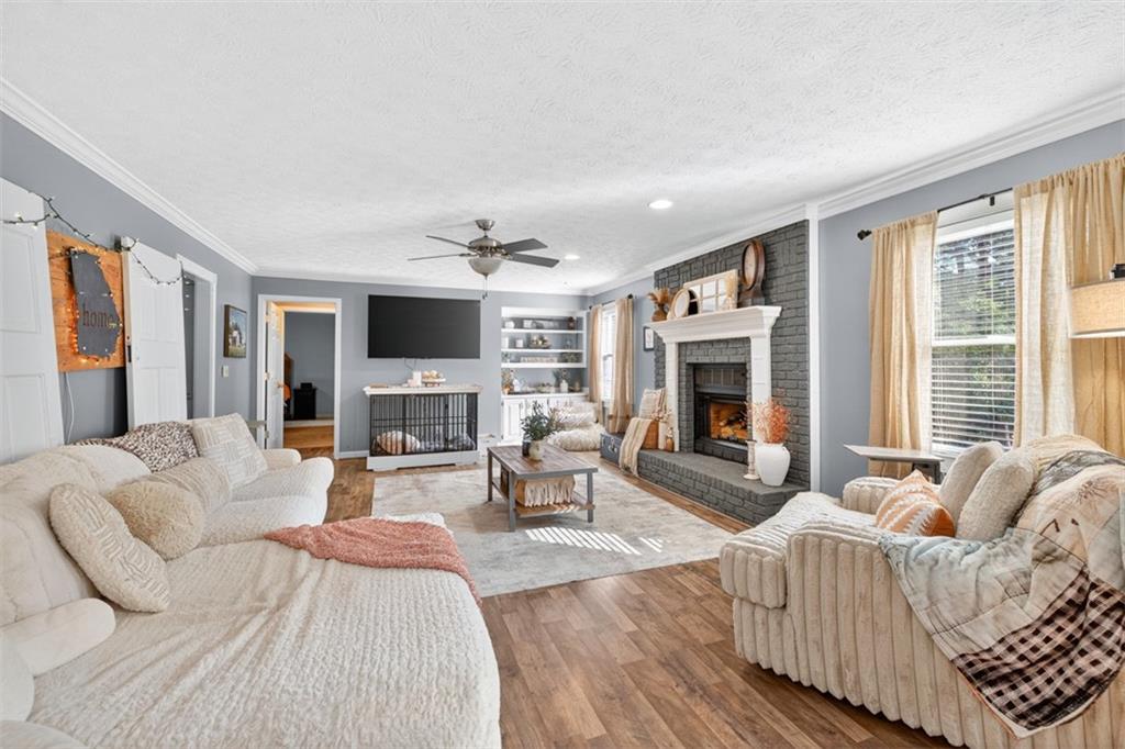 2380 Camp Mitchell Road Grayson, GA 30017 - Photo 11 of 56 a living room with furniture fireplace and flat screen tv