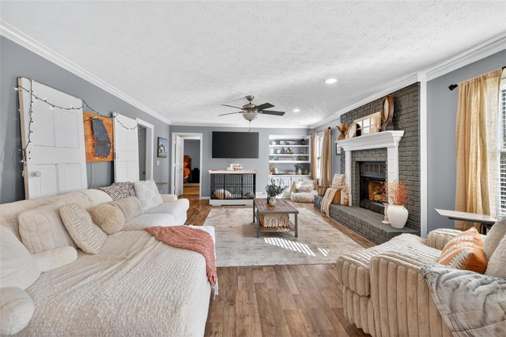 2380 Camp Mitchell Road Grayson, GA 30017 - Photo 12 of 56 a living room with furniture fireplace and flat screen tv