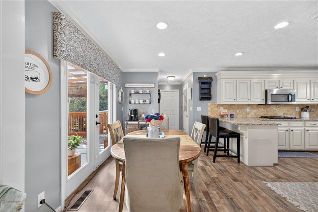 2380 Camp Mitchell Road Grayson, GA 30017 - Photo 14 of 56 a living room with stainless steel appliances granite countertop furniture and a kitchen view