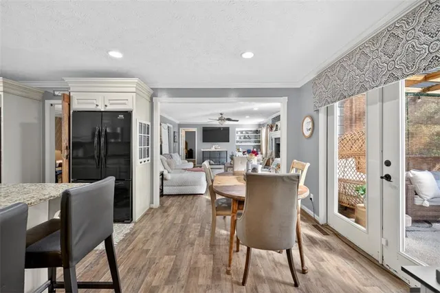 a kitchen with stainless steel appliances granite countertop a refrigerator a sink a stove and oven