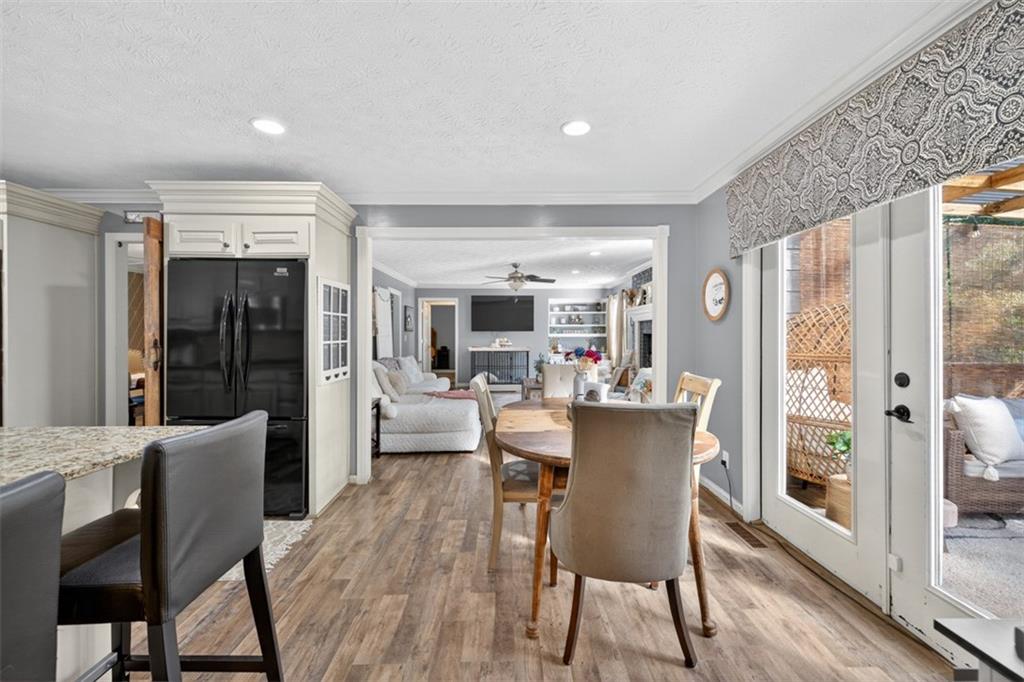 2380 Camp Mitchell Road Grayson, GA 30017 - Photo 16 of 56 a dining room with furniture window and wooden floor