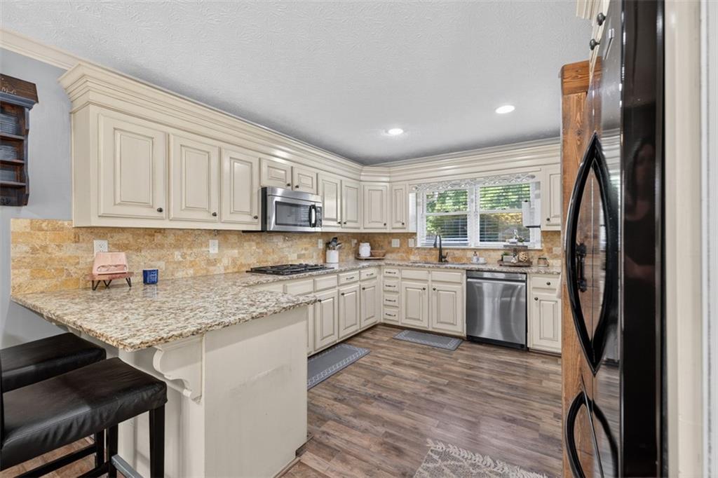 2380 Camp Mitchell Road Grayson, GA 30017 - Photo 20 of 56 a kitchen with a sink stainless steel appliances and window
