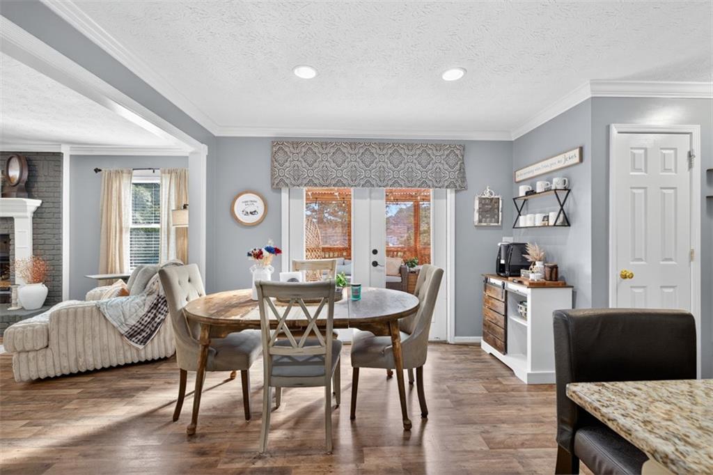2380 Camp Mitchell Road Grayson, GA 30017 - Photo 22 of 56 a view of a dining room with furniture and wooden floor
