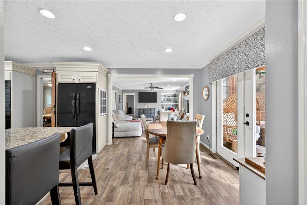 2380 Camp Mitchell Road Grayson, GA 30017 - Photo 23 of 56 a view of a dining room with furniture window and wooden floor