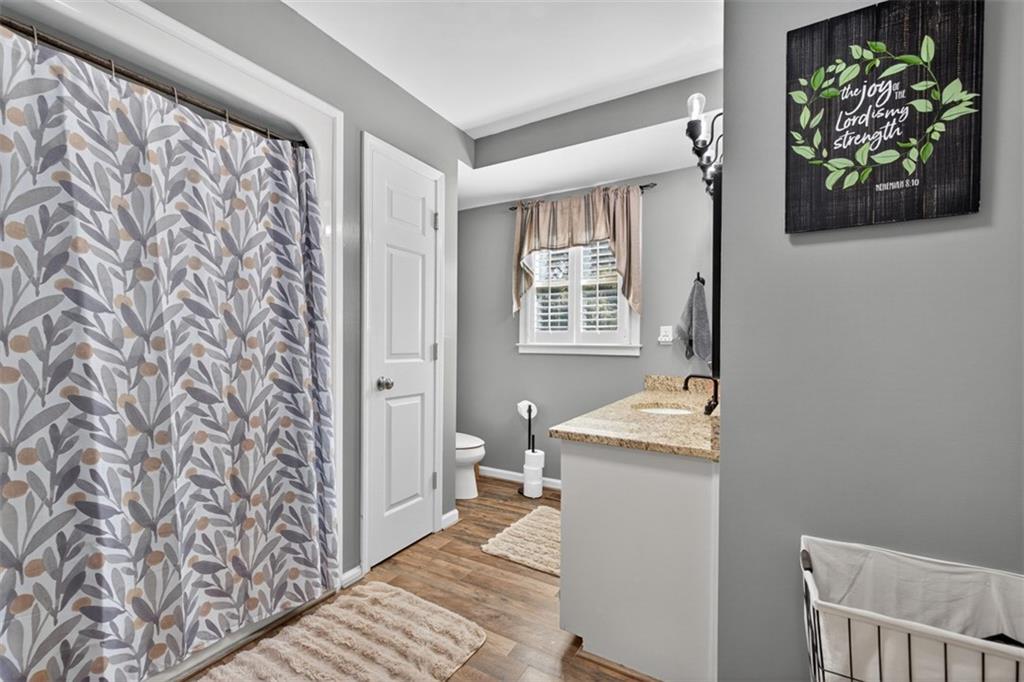 2380 Camp Mitchell Road Grayson, GA 30017 - Photo 24 of 56 a hallway with a stove top oven a rug and a window