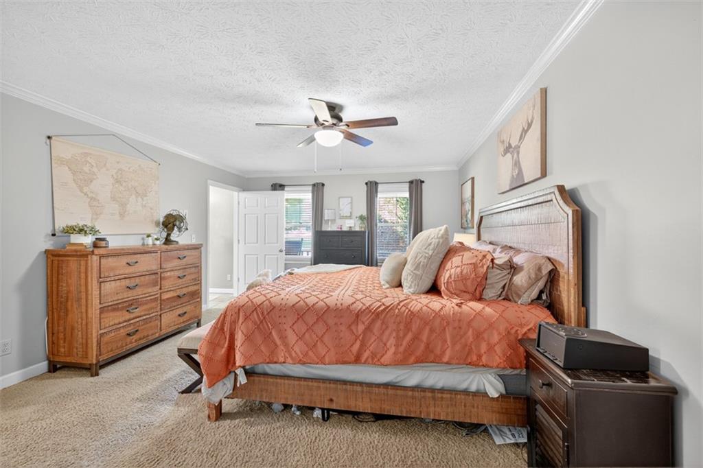 2380 Camp Mitchell Road Grayson, GA 30017 - Photo 26 of 56 a bedroom with a bed and a chandelier