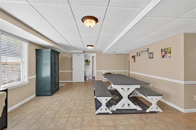 a bedroom with a bed and a lamp