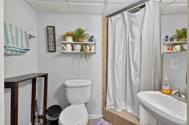 a spacious bedroom with a bed and a walk in closet