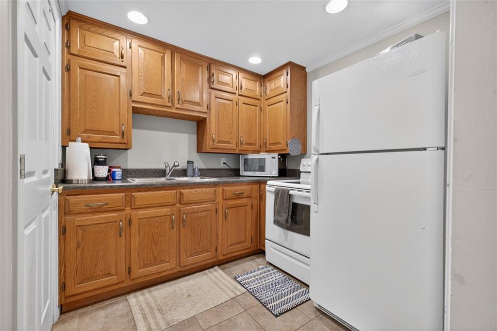 2380 Camp Mitchell Road Grayson, GA 30017 - Photo 41 of 56 a kitchen with stainless steel appliances granite countertop a refrigerator sink and cabinets