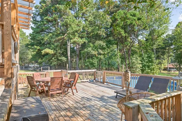 a view of a swimming pool with a yard