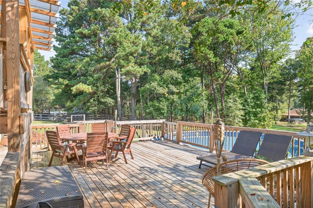 2380 Camp Mitchell Road Grayson, GA 30017 - Photo 44 of 56 a view of a patio with wooden floor