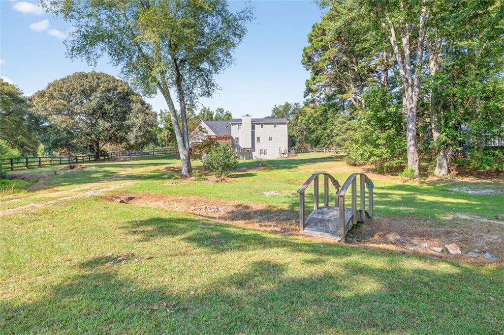 2380 Camp Mitchell Road Grayson, GA 30017 - Photo 47 of 56 a view of a swimming pool with a yard