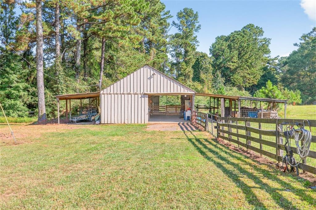 2380 Camp Mitchell Road Grayson, GA 30017 - Photo 48 of 56 a view of a house with backyard and sitting area