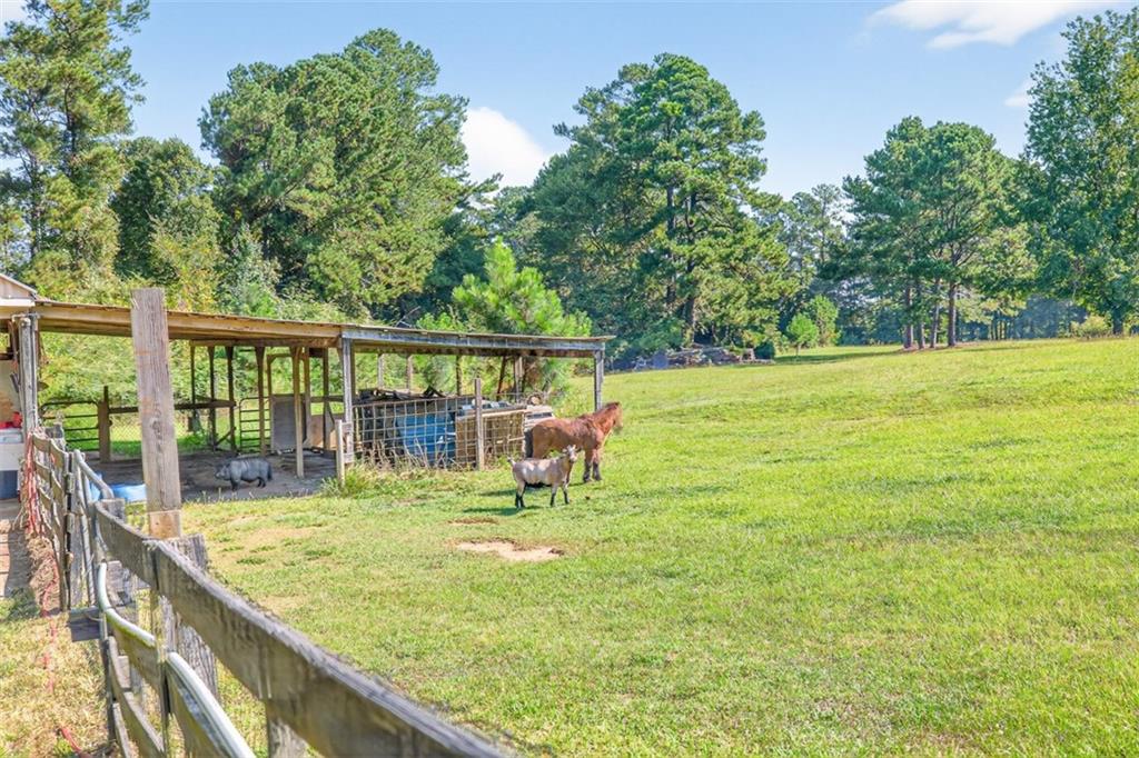 2380 Camp Mitchell Road Grayson, GA 30017 - Photo 49 of 56 a view of a swimming pool with a patio