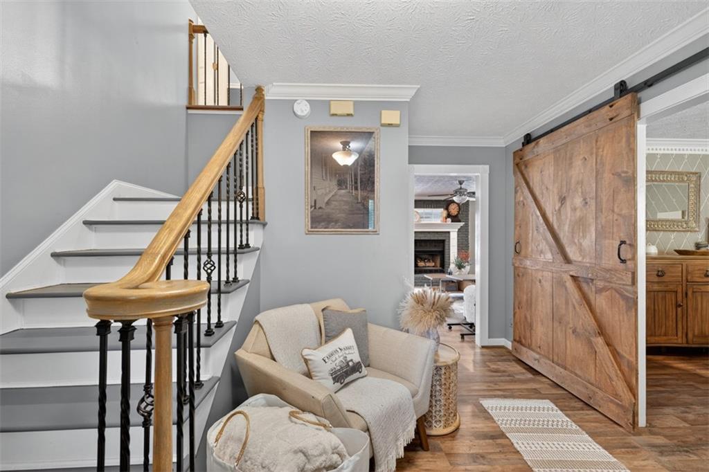 2380 Camp Mitchell Road Grayson, GA 30017 - Photo 5 of 56 a living room with furniture and a stairs