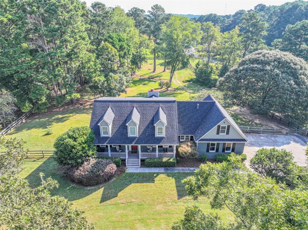 2380 Camp Mitchell Road Grayson, GA 30017 - Photo 54 of 56 a aerial view of a house with swimming pool and a yard