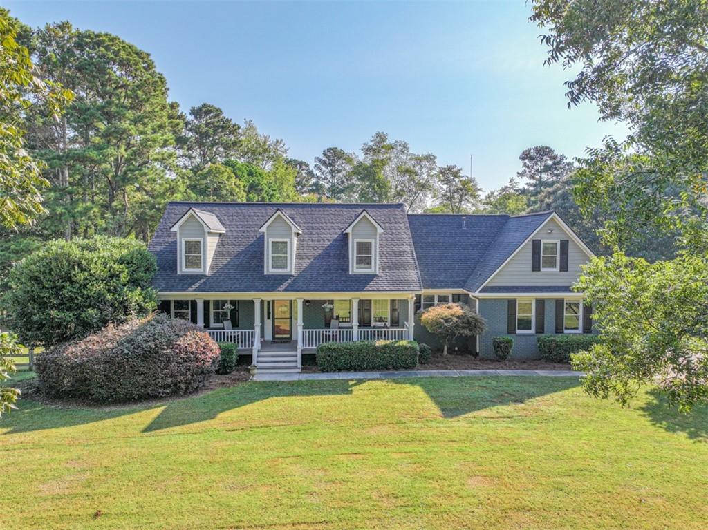 2380 Camp Mitchell Road Grayson, GA 30017 - Photo 55 of 56 a front view of a house with a yard