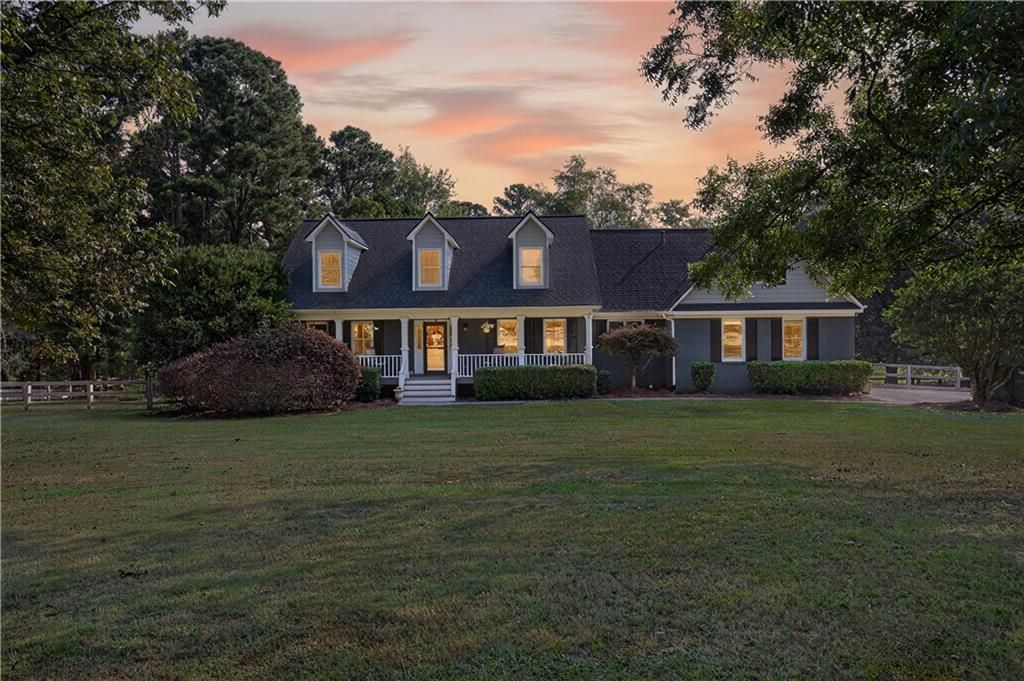 2380 Camp Mitchell Road Grayson, GA 30017 - Photo 56 of 56 a front view of a house with a garden
