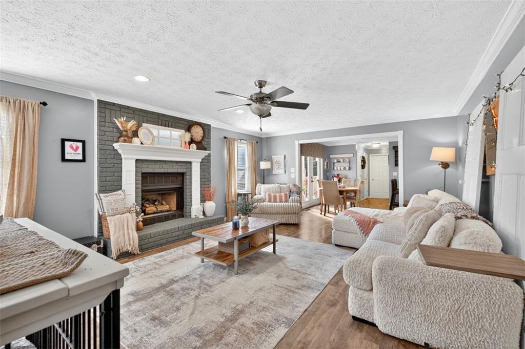 2380 Camp Mitchell Road Grayson, GA 30017 - Photo 9 of 56 a living room with furniture and a fireplace