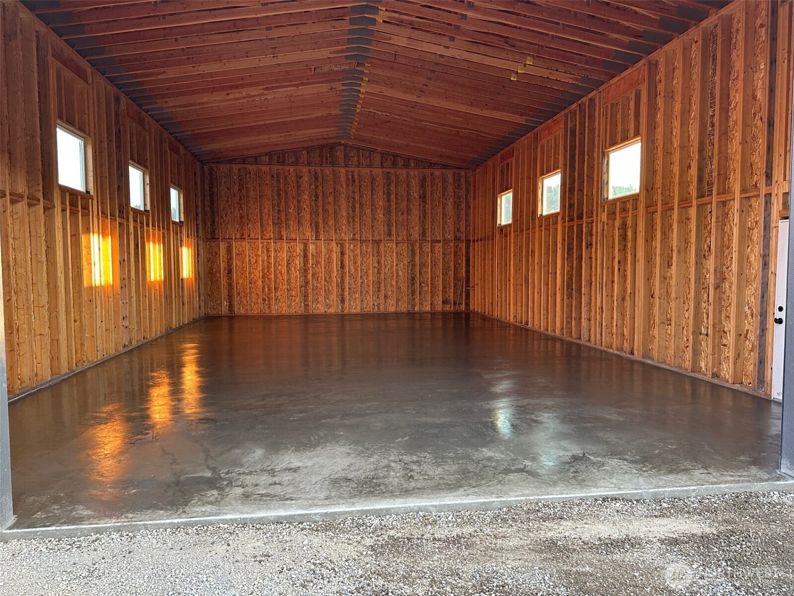 521 3 Lakes Road Cle Elum, WA 98922 - Photo 2 of 9 an empty room with wooden floor and windows