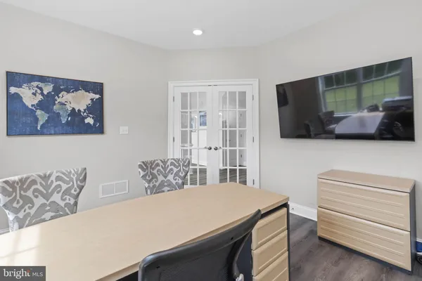 a room with furniture and a flat screen tv