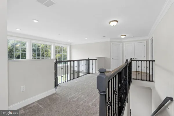 a view of a hallway with windows