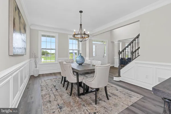 a view of a dining room with furniture and window