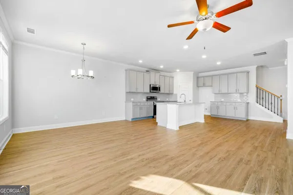 a view of kitchen with wooden floor and window